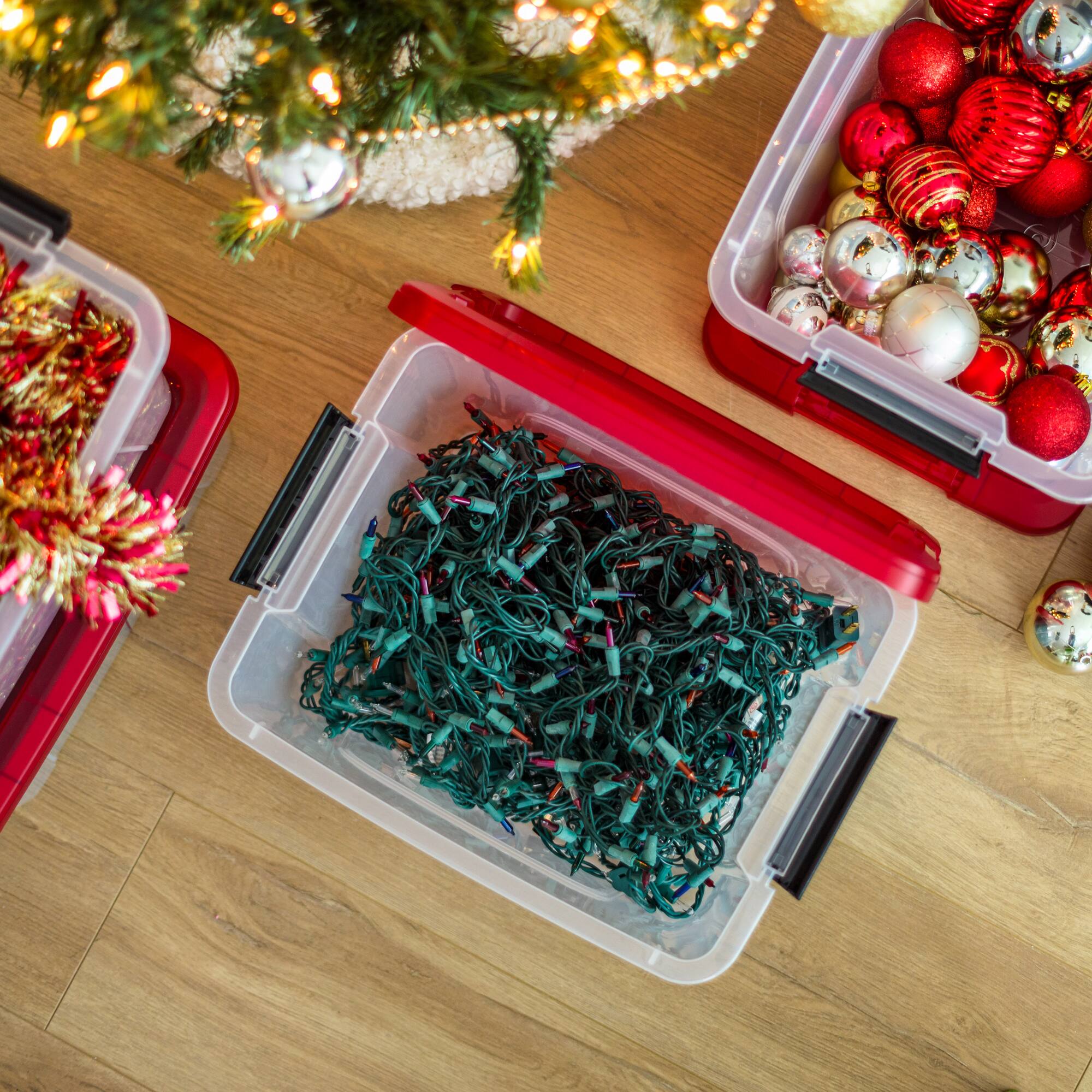 IRIS® 20.5qt. Clear Holiday Storage Boxes with Red Buckle Lids, 4ct.